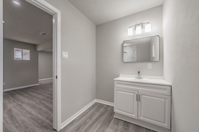 bathroom featuring vanity and hardwood / wood-style floors