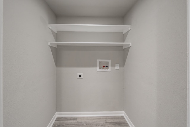 laundry area featuring washer hookup, hardwood / wood-style floors, and hookup for an electric dryer