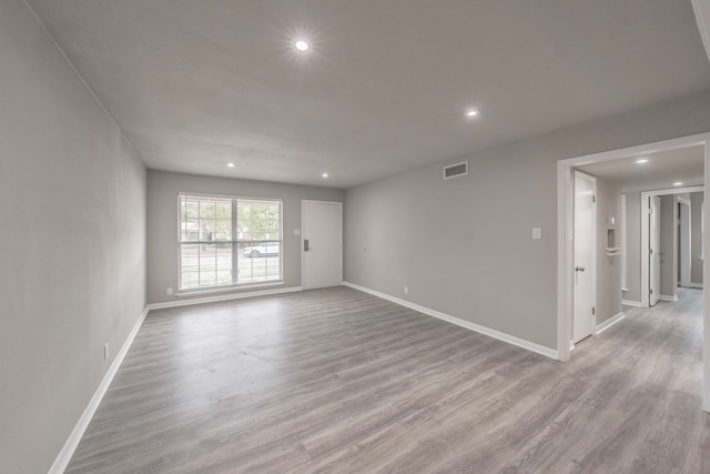 unfurnished room featuring light wood-type flooring