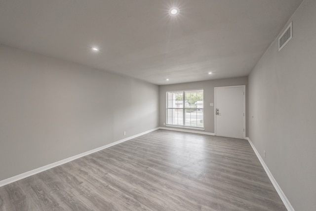 unfurnished room featuring light hardwood / wood-style flooring