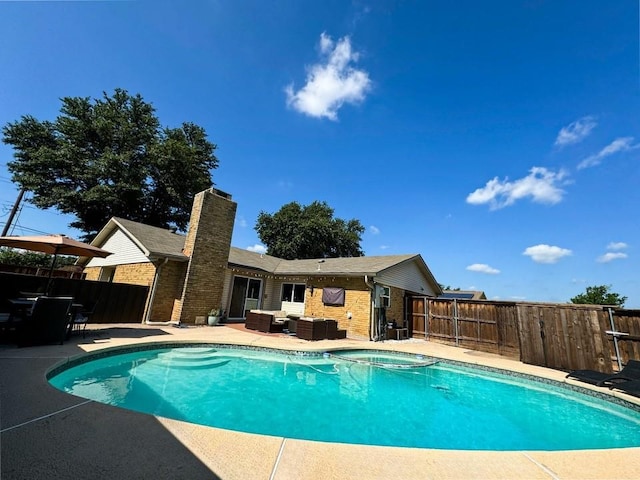 view of pool featuring an outdoor hangout area and a patio