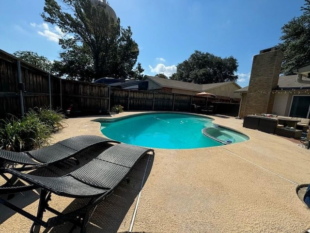 view of pool with an outdoor living space and a patio