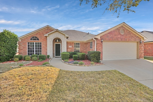 single story home with a front yard and a garage