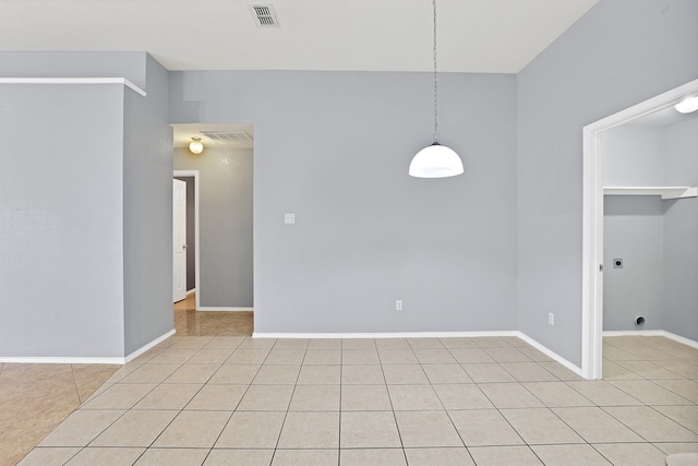 spare room featuring light tile patterned floors