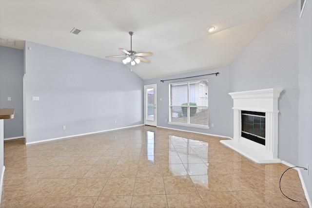 unfurnished living room featuring lofted ceiling, ceiling fan, and light tile patterned floors