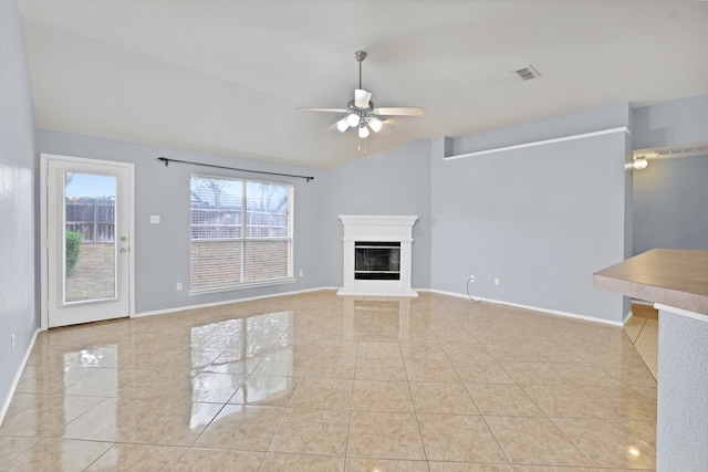 unfurnished living room featuring lofted ceiling, light tile patterned flooring, and ceiling fan