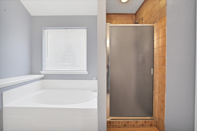 bathroom featuring plus walk in shower