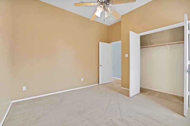 unfurnished bedroom with a closet, ceiling fan, and light carpet