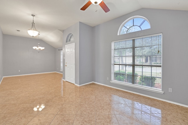 unfurnished room with lofted ceiling, ceiling fan with notable chandelier, and light tile patterned floors