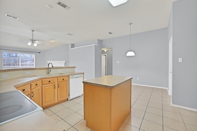 kitchen featuring ceiling fan, white dishwasher, light tile patterned floors, and a kitchen island