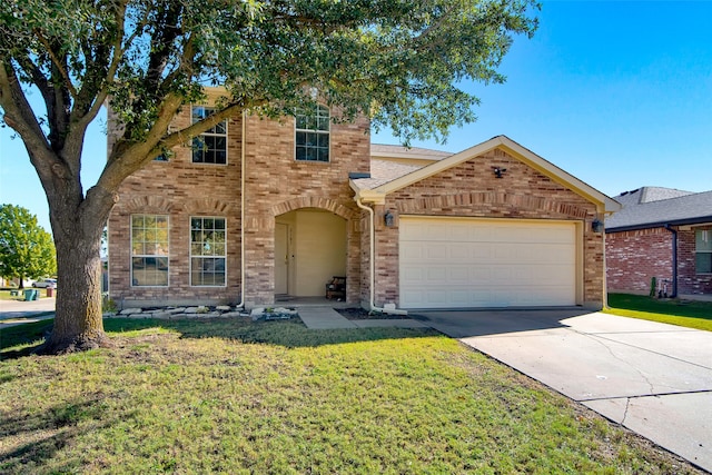 view of front of house with a garage and a front yard