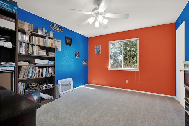 interior space with carpet and ceiling fan