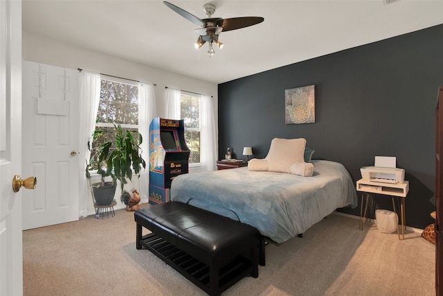 bedroom featuring ceiling fan and carpet floors