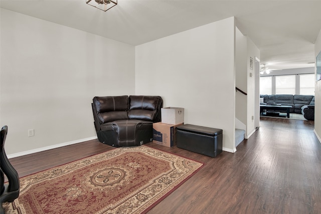 living area with hardwood / wood-style flooring and ceiling fan