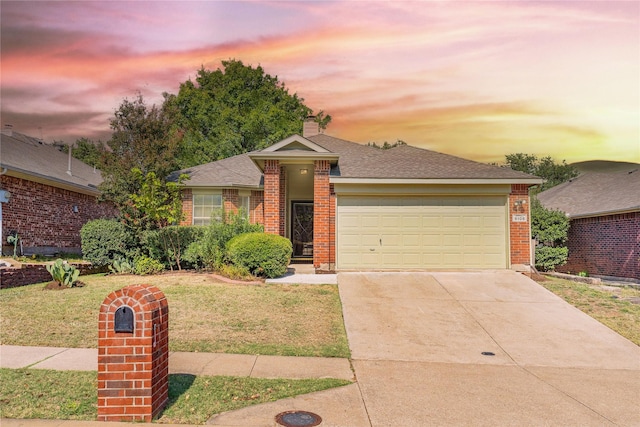 ranch-style home with a garage and a front lawn