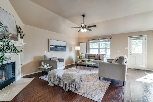 living room featuring ceiling fan, a healthy amount of sunlight, lofted ceiling, and hardwood / wood-style floors