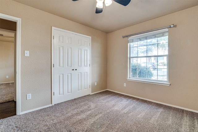 unfurnished bedroom with carpet flooring and ceiling fan