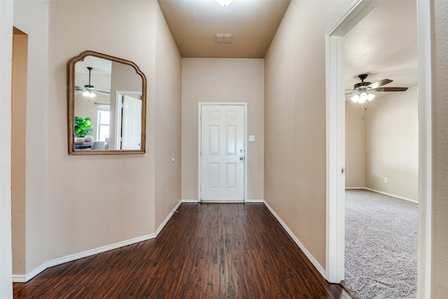 hall with dark hardwood / wood-style floors