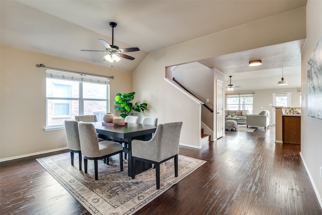 dining area with vaulted ceiling, dark hardwood / wood-style floors, and ceiling fan