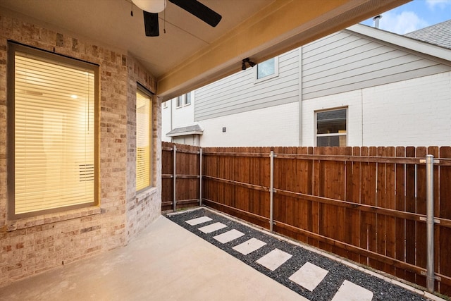 view of patio featuring ceiling fan