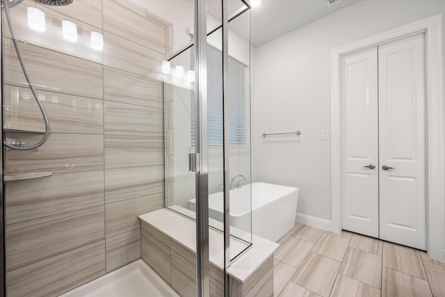 bathroom featuring separate shower and tub