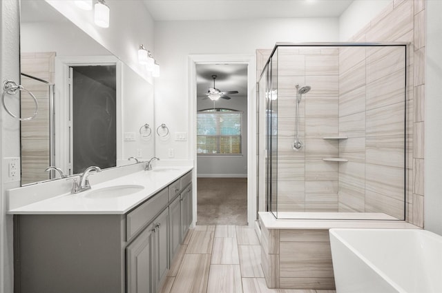 bathroom with separate shower and tub, ceiling fan, and vanity