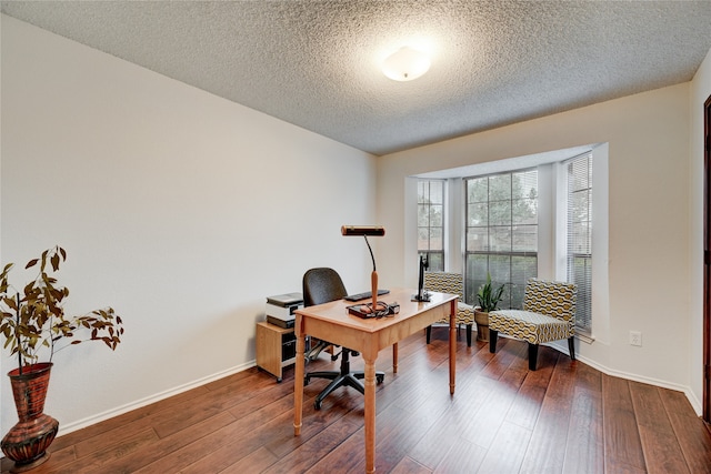 office with a textured ceiling and dark hardwood / wood-style floors