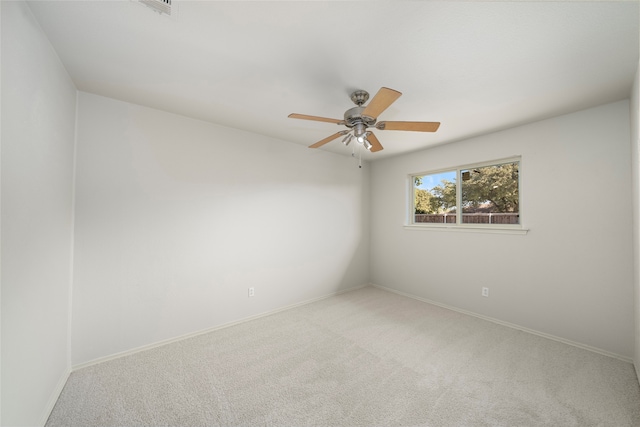 spare room featuring carpet flooring and ceiling fan