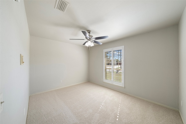 carpeted empty room with ceiling fan