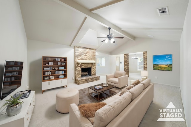 living room featuring vaulted ceiling with beams, light carpet, a brick fireplace, and ceiling fan