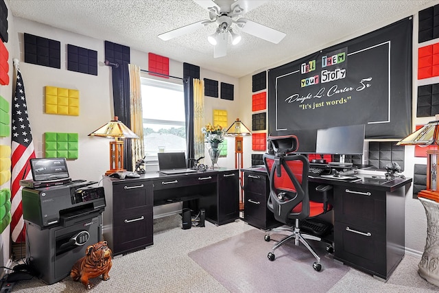 carpeted office with a textured ceiling and ceiling fan