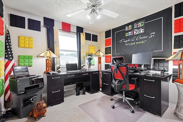 carpeted office with ceiling fan and a textured ceiling