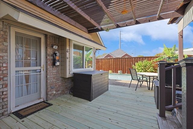 deck featuring a pergola and a swimming pool