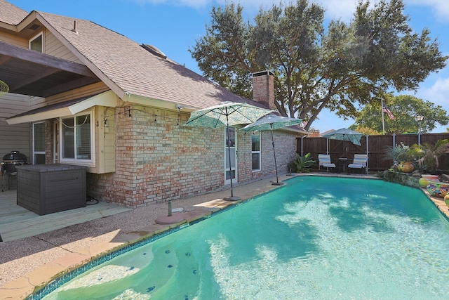 view of swimming pool with a patio