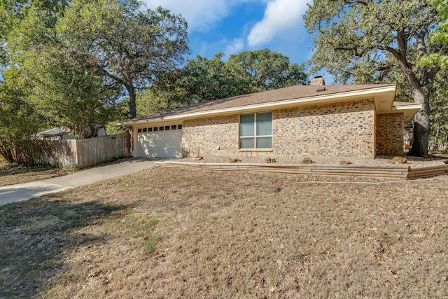 exterior space with a yard and a garage