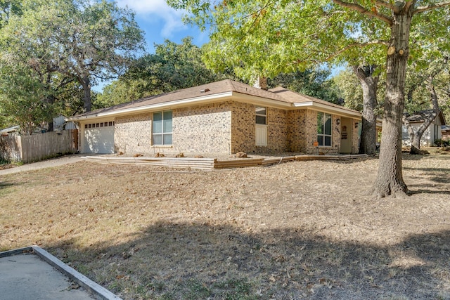 ranch-style home featuring a garage