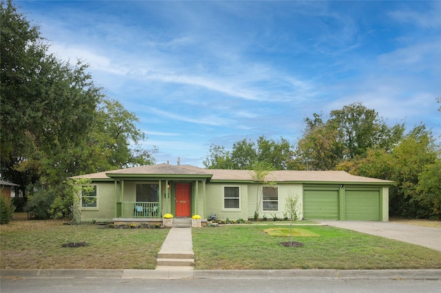 single story home with a garage, a front yard, and covered porch