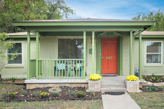 doorway to property with covered porch