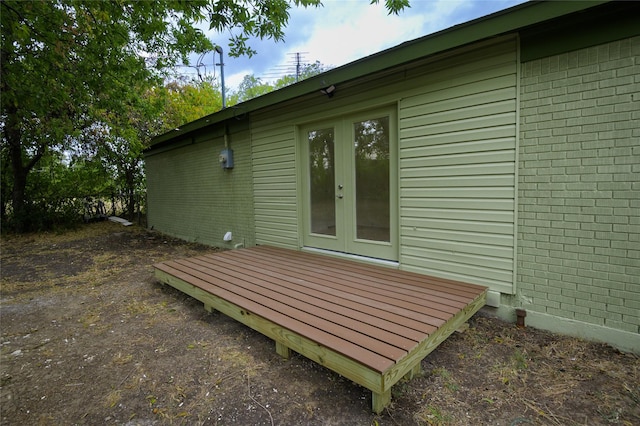 exterior space featuring a wooden deck and french doors