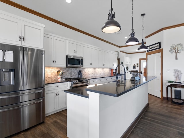 kitchen featuring a kitchen island with sink, white cabinetry, and stainless steel appliances