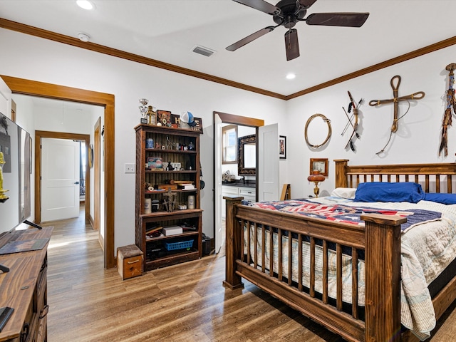 bedroom with ceiling fan, crown molding, and hardwood / wood-style floors