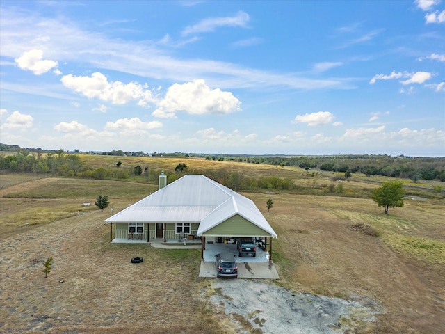 birds eye view of property with a rural view