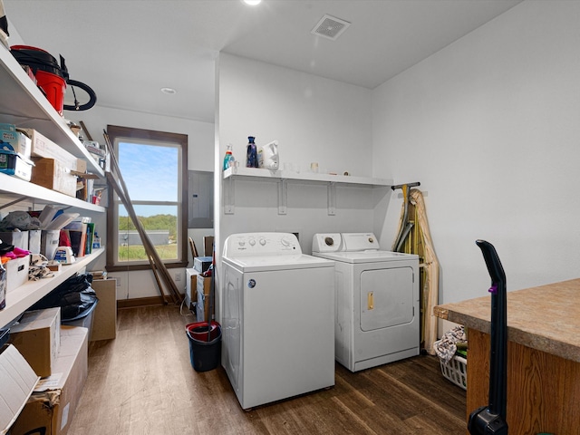 laundry area with independent washer and dryer and dark hardwood / wood-style flooring