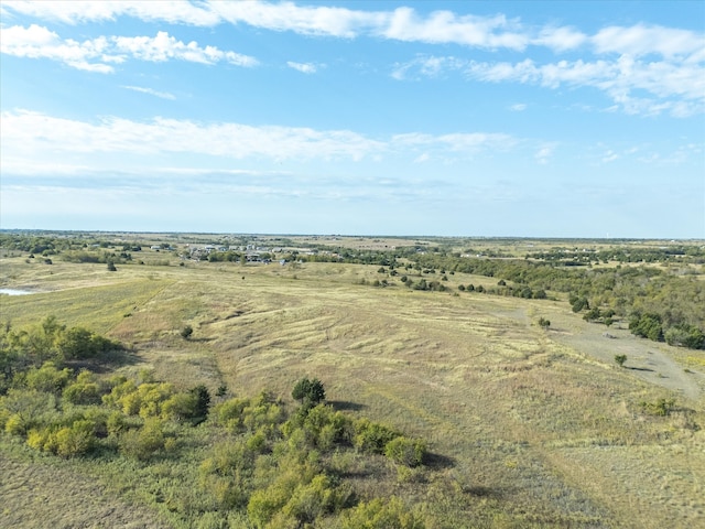 birds eye view of property with a rural view