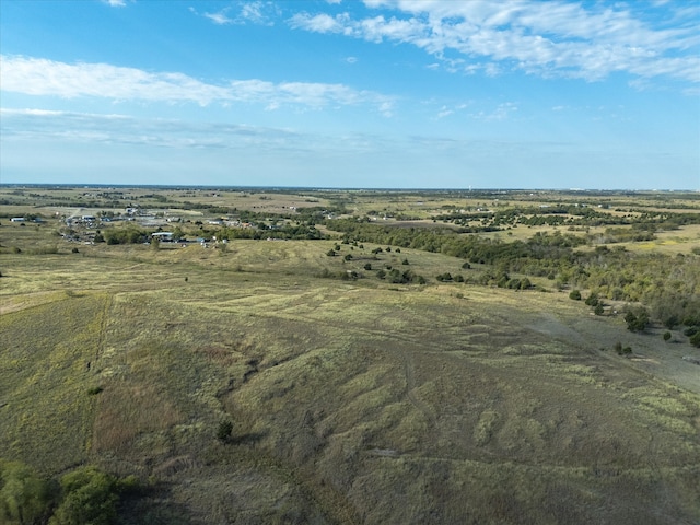 birds eye view of property with a rural view