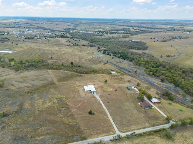 birds eye view of property with a rural view