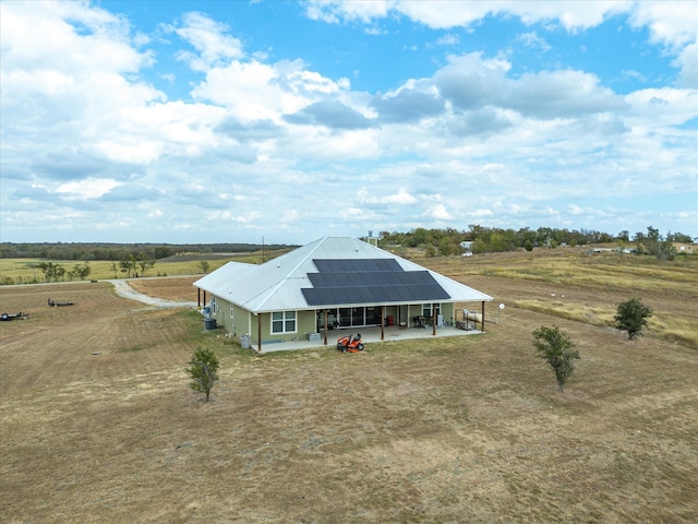 exterior space featuring a rural view and solar panels