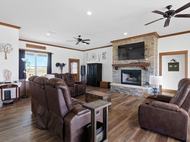 living room with crown molding, a fireplace, dark hardwood / wood-style floors, and ceiling fan