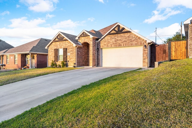 view of front of house featuring a front lawn and a garage