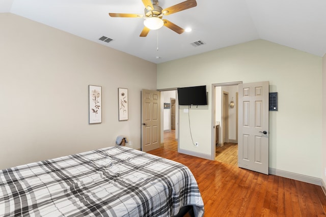 bedroom featuring lofted ceiling, hardwood / wood-style flooring, and ceiling fan